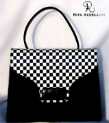 Rita Azzellini � la collezione e firma di una azienda artigianale che porta il suo nome e che si colloca, per consenso e diritto, nel multiforme mondo della moda e della creazione tipicamente italiana. Da Designer di "Borse e Pellame", Rita vanta inizi assai precoci avendo appreso, sin da giovanissima, l'arte della "creazione" durante un lungo percorso di apprendimento e supporto accanto ad autentici Maestri del settore